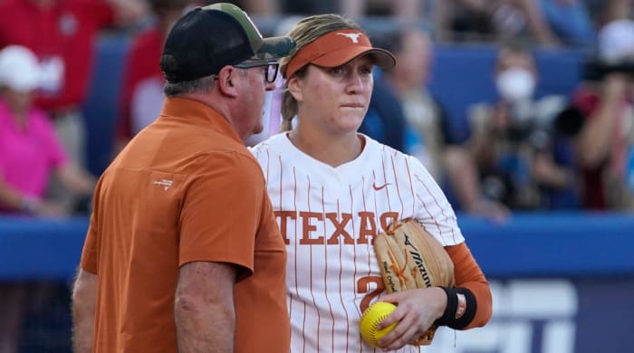 Texas pitcher Hailey Dolcini is pulled in the first inning of Game 1 in the Women’s College World Series